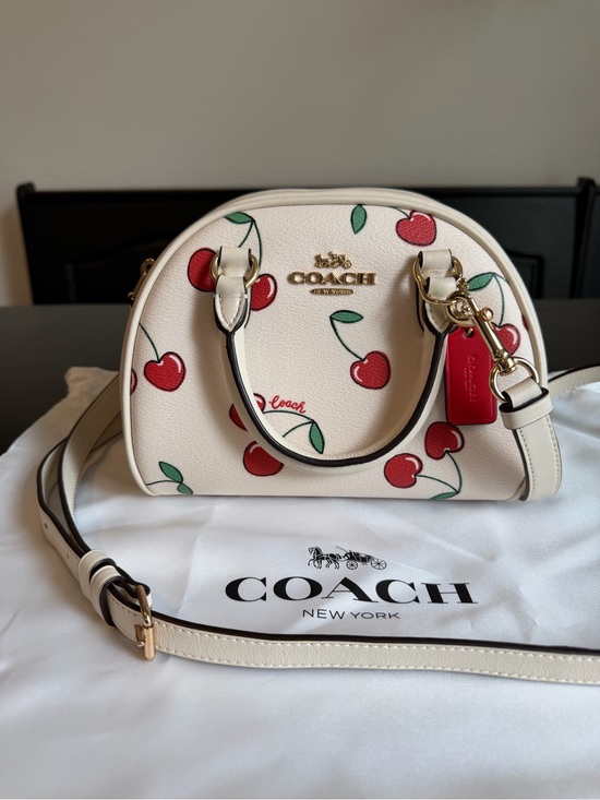 Coach Handbags - Coach Cream Crossbody Bag with Red Cherry Print